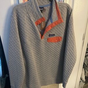Patagonia grey with salmon trim, quilted. Xl with tags. Non smoking home